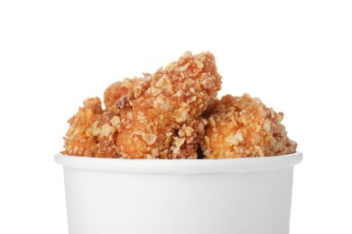 Photo of Bucket with yummy fried nuggets on white background, closeup