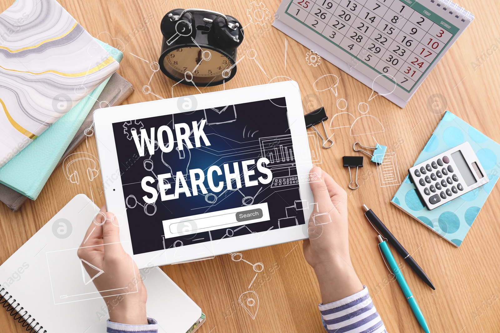 Image of Woman using tablet for job search at table, closeup