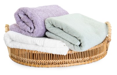 Basket with different soft towels isolated on white