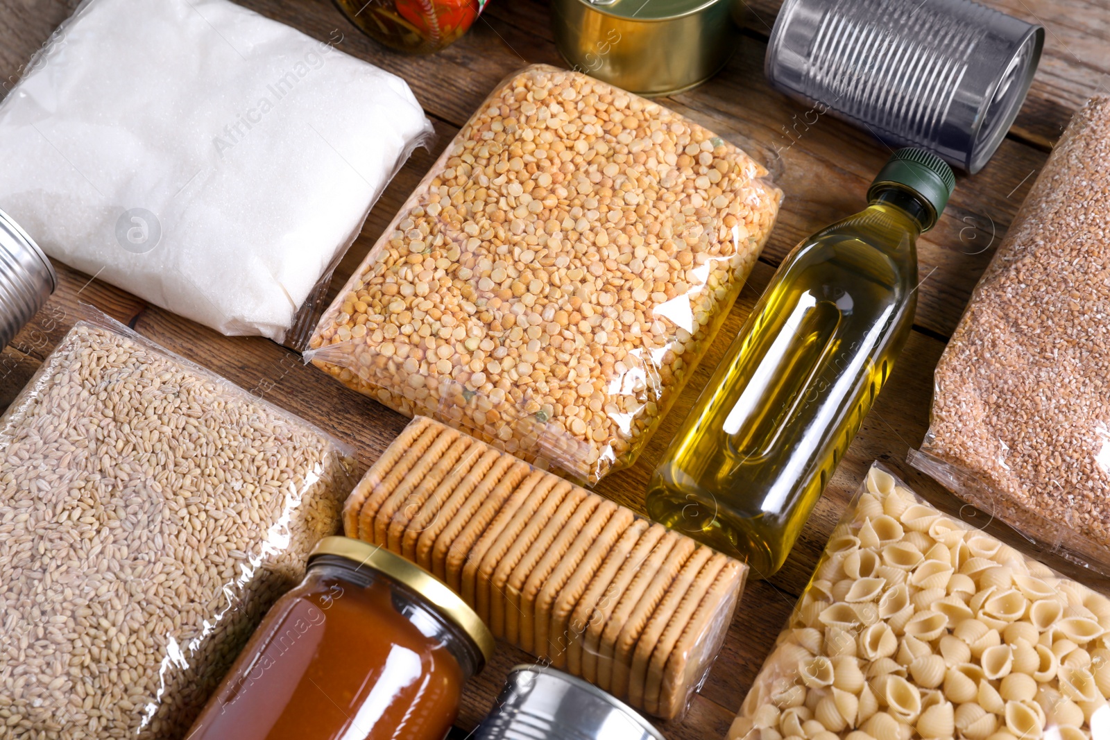 Photo of Different products on wooden table. Food donation