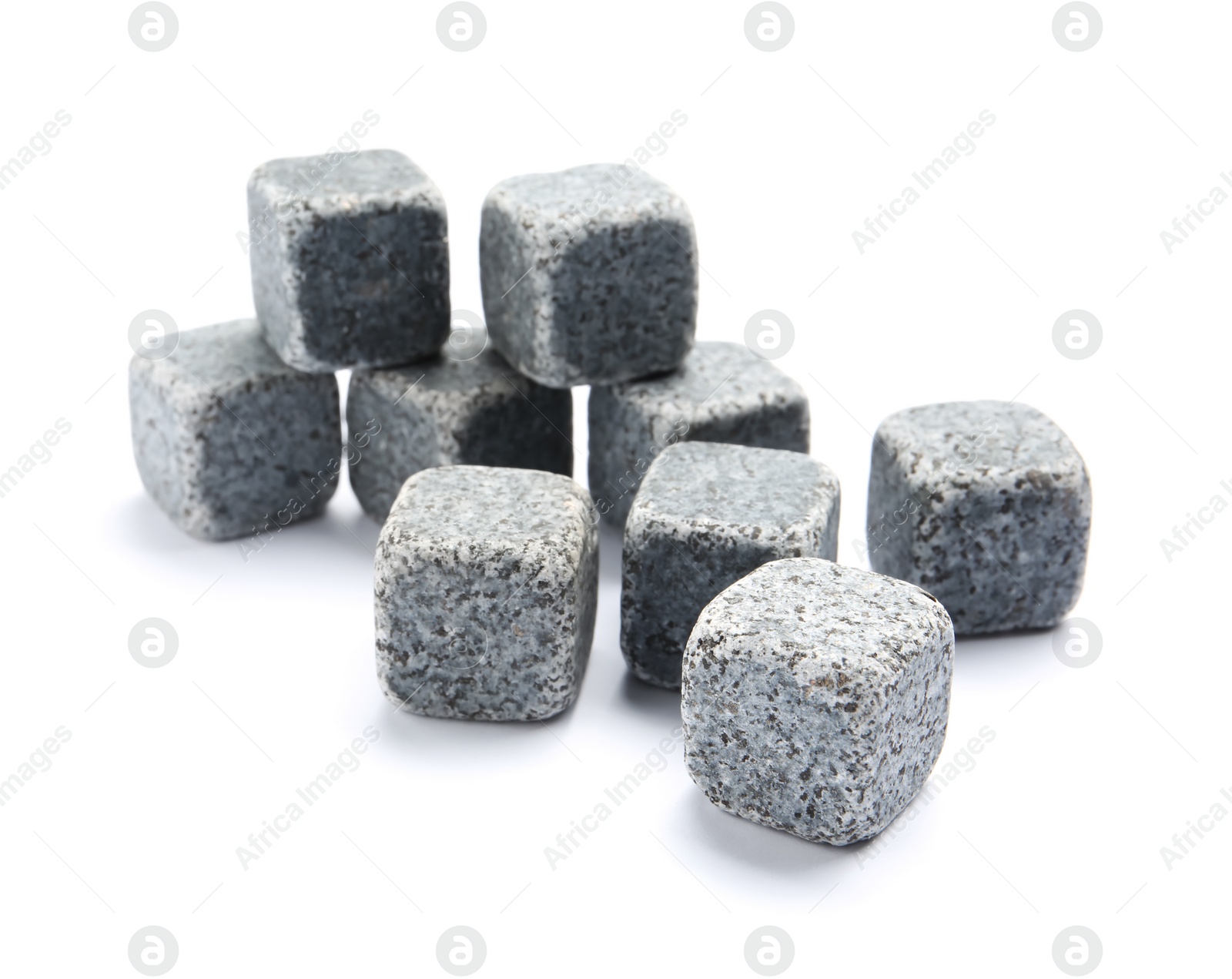 Photo of Classic grey whiskey stones on white background