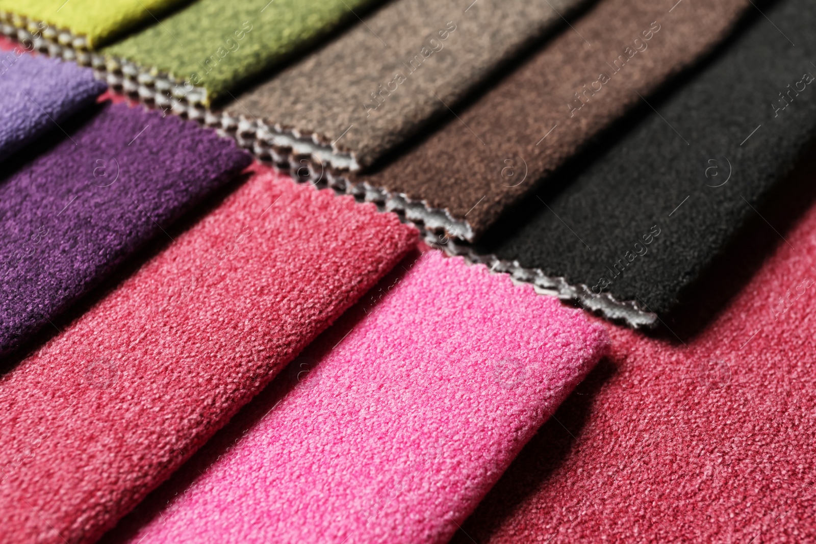 Photo of Fabric samples of different colors for interior design as background