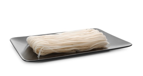 Plate with raw rice noodles on white background