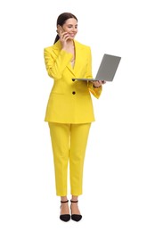 Photo of Beautiful businesswoman in yellow suit with laptop talking on smartphone against white background