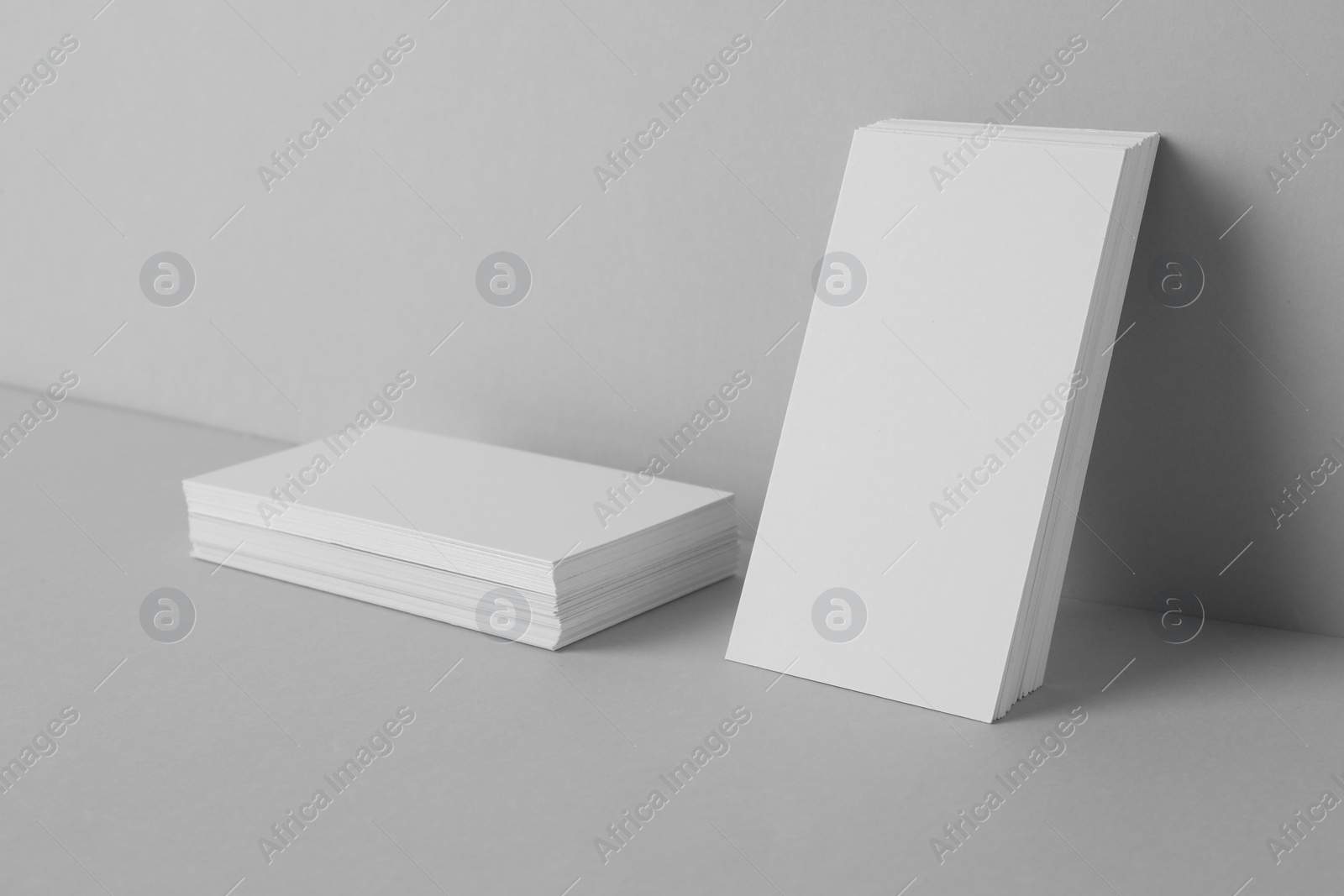 Photo of Blank business cards on light gray background. Mockup for design