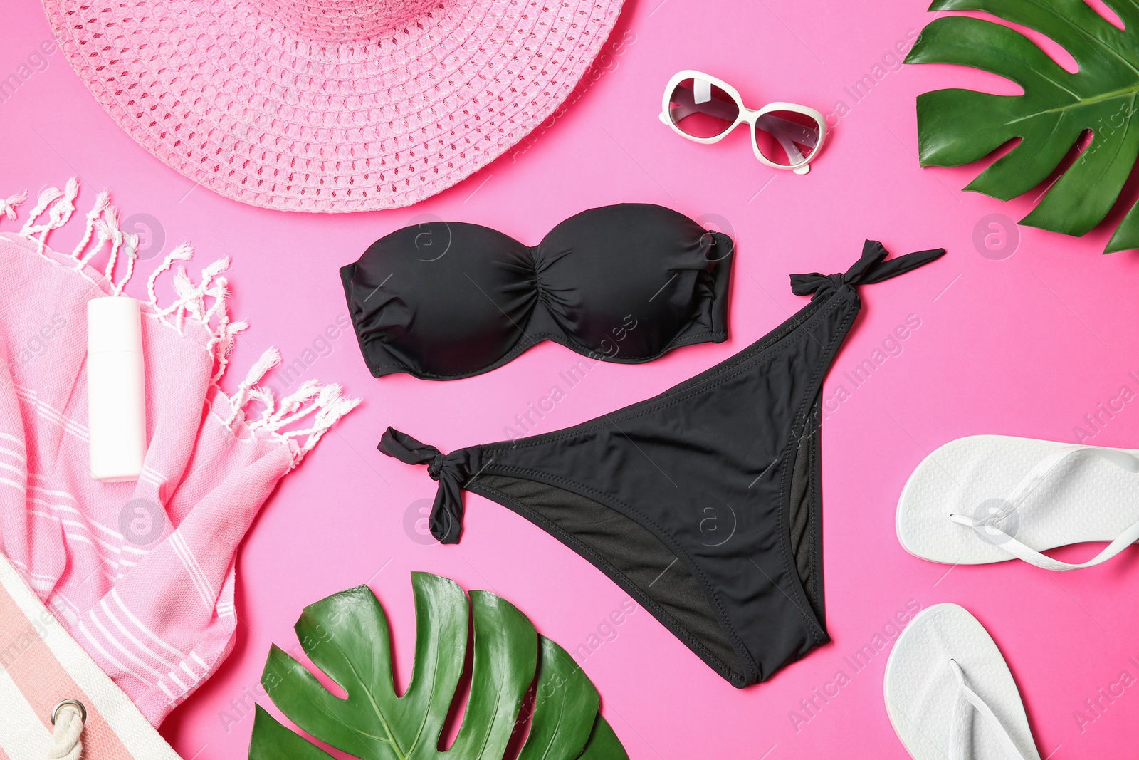 Photo of Flat lay composition with stylish bikini on color background