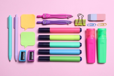 Photo of Different school stationery on pink background, flat lay
