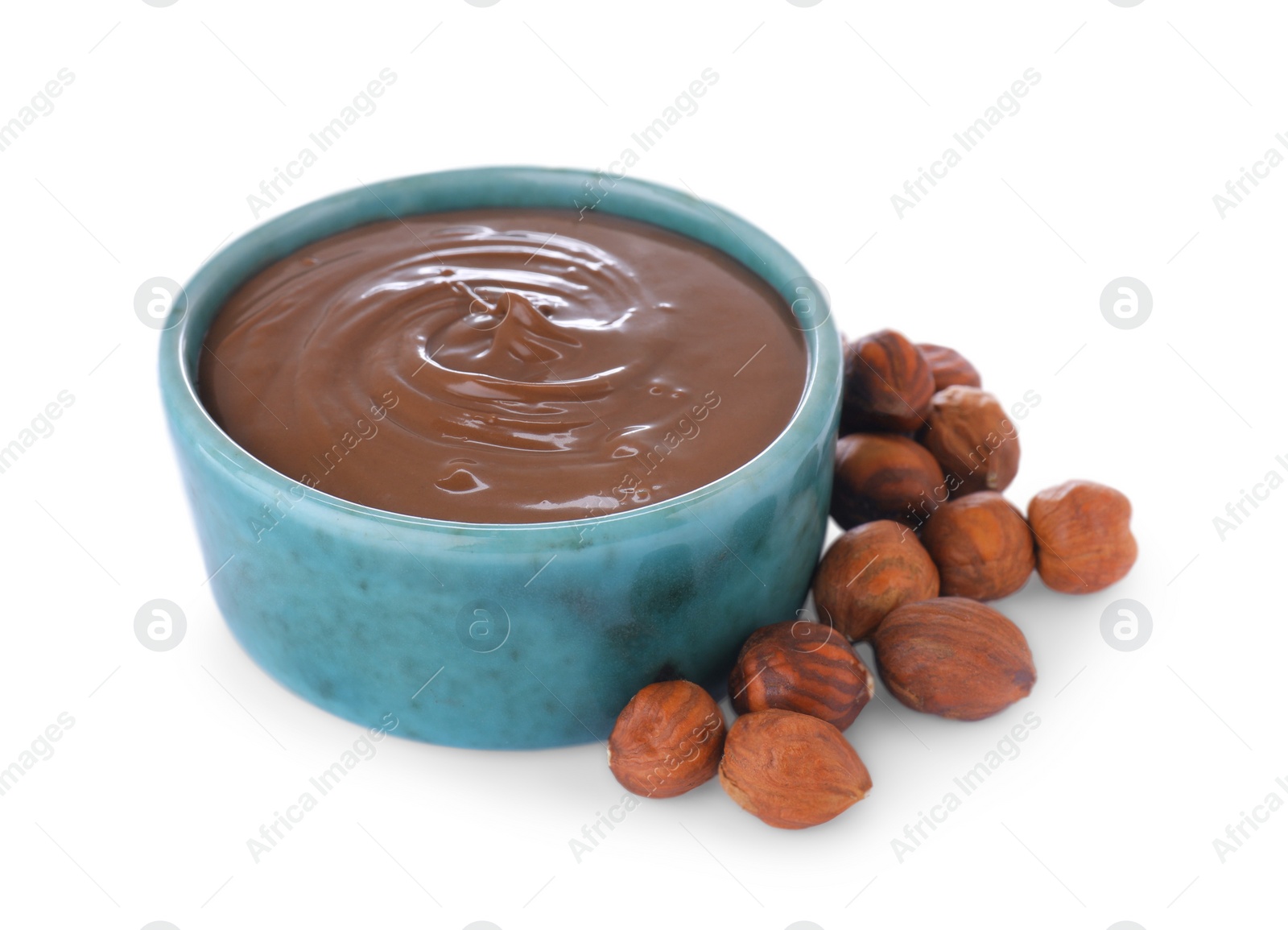 Photo of Bowl with tasty chocolate paste and nuts isolated on white