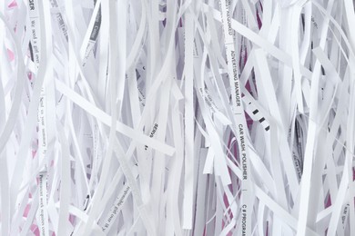 Heap of shredded paper strips as background, top view