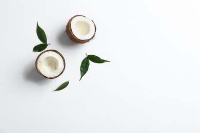 Composition with coconuts on white background, top view