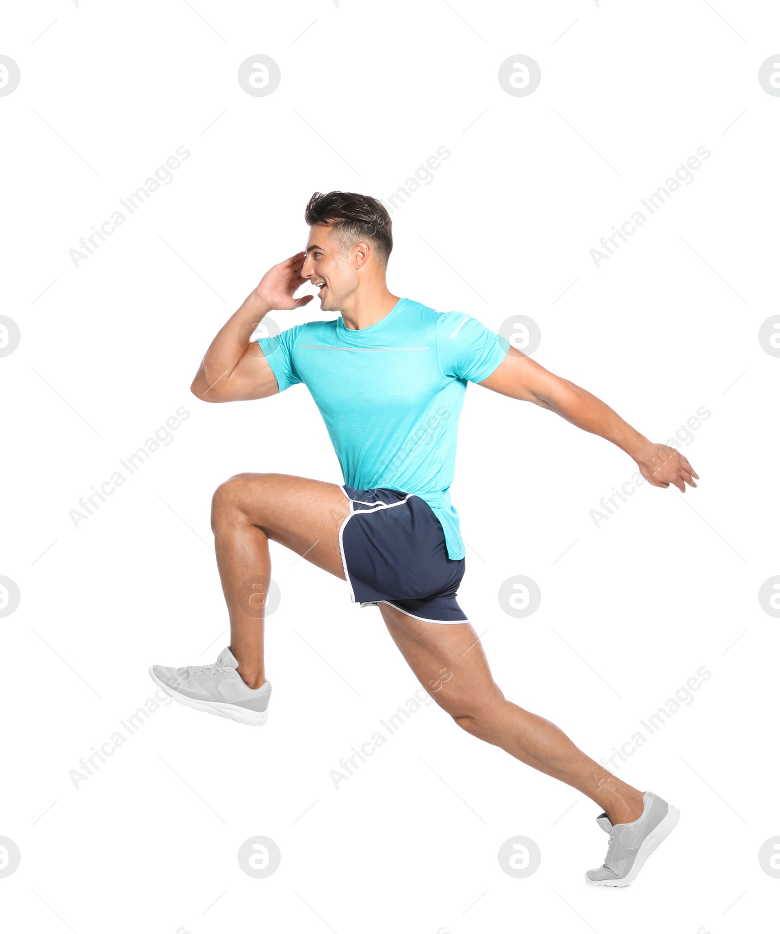Photo of Handsome young man running on white background