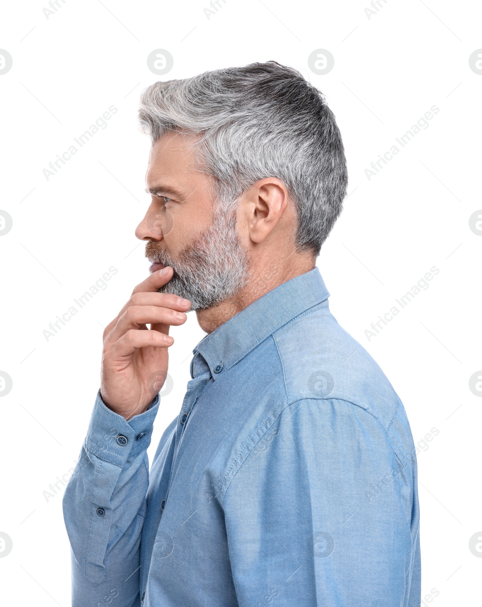 Photo of Mature businessman in stylish clothes posing on white background