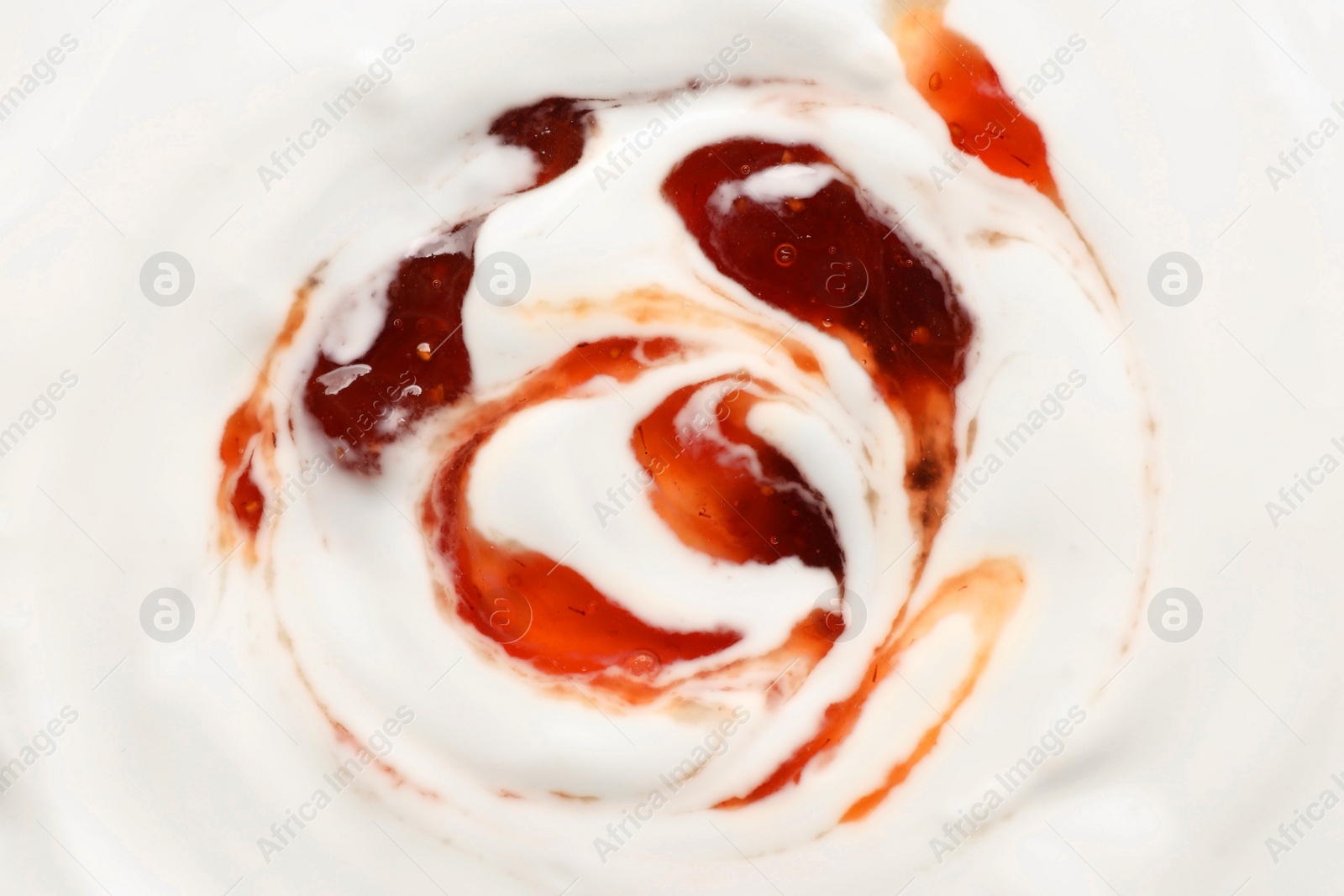 Photo of Tasty yoghurt with jam as background, top view