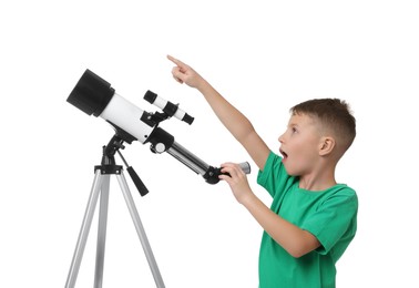 Photo of Surprised little boy with telescope pointing at something on white background