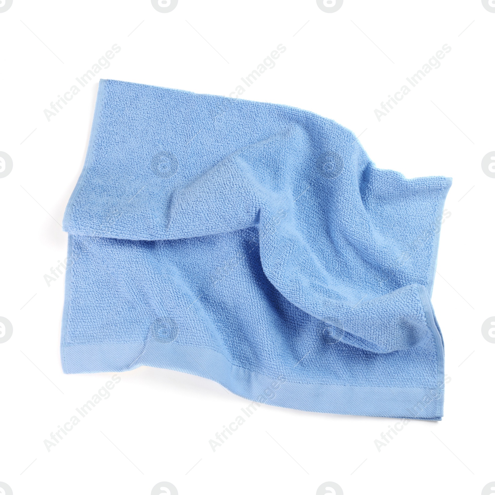 Photo of Light blue soft terry towel isolated on white, top view