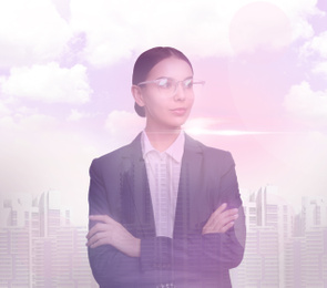 Double exposure of businesswoman and cityscape, toned in pink
