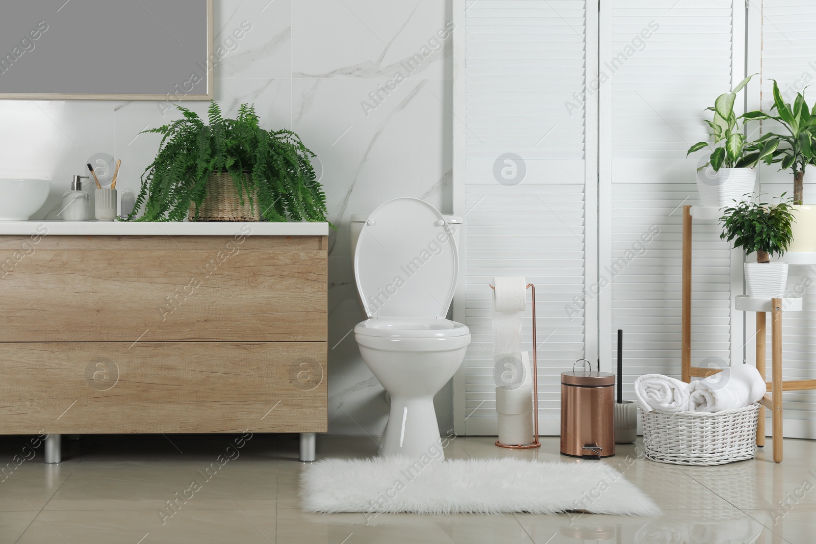 Photo of Stylish toilet bowl in modern bathroom interior