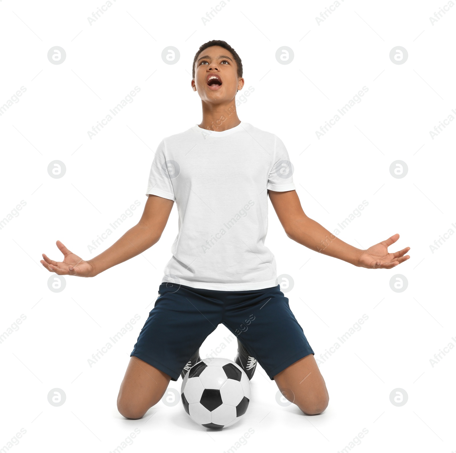 Photo of Teenage African-American football player on white background