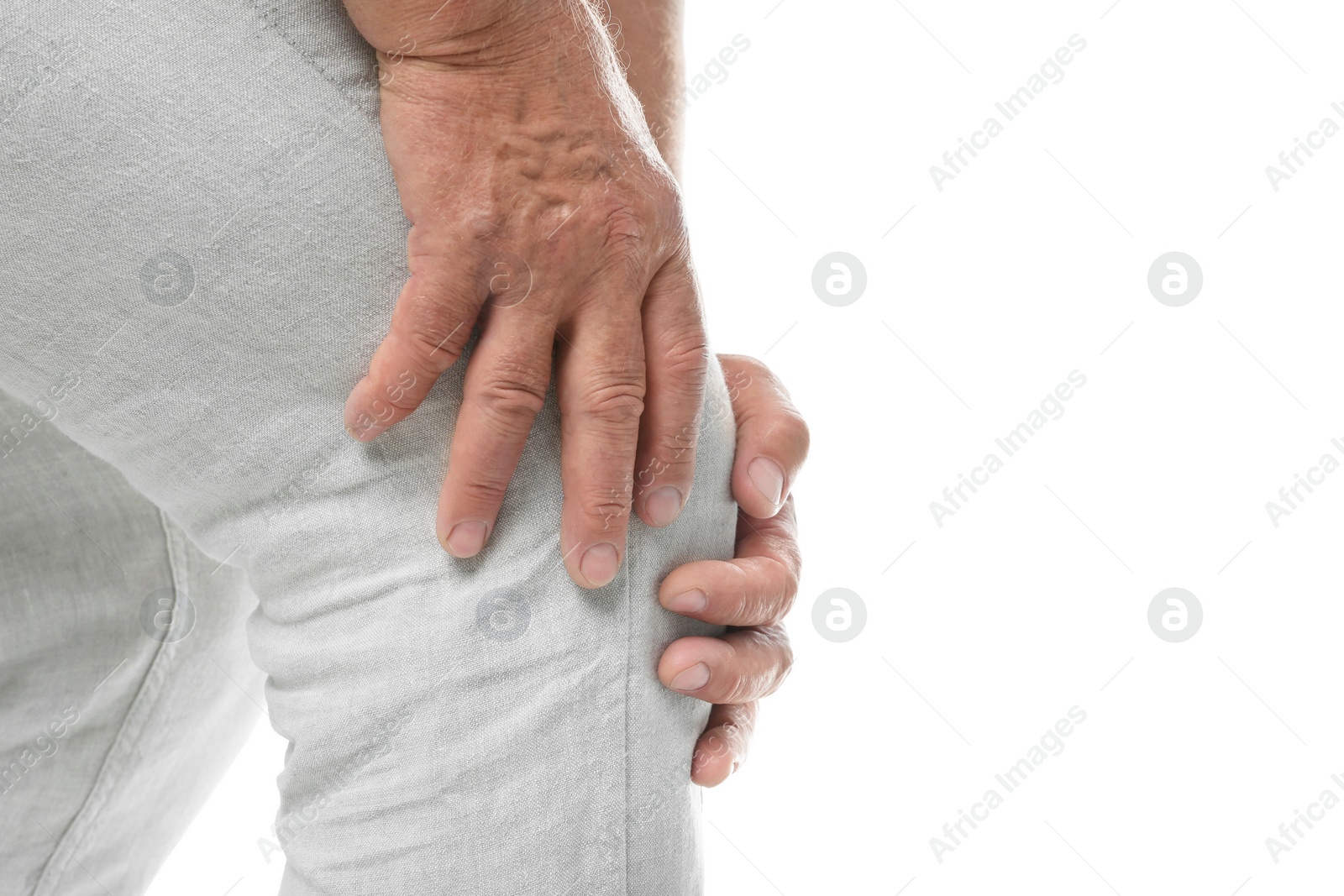 Photo of Senior man having knee problems on white background, closeup