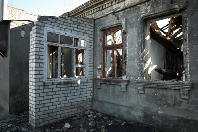 Photo of Ruined house with broken windows after strong earthquake