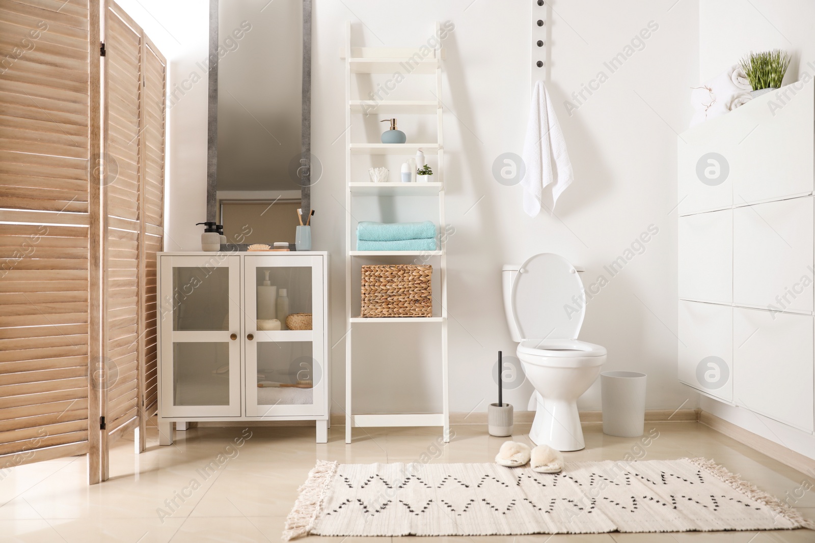 Photo of Interior of stylish bathroom with toilet bowl