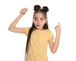 Photo of Emotional little girl with slime on white background
