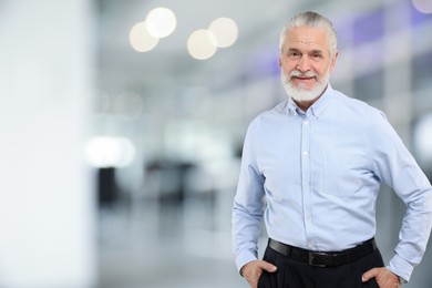 Image of Portrait of handsome senior man in office, space for text