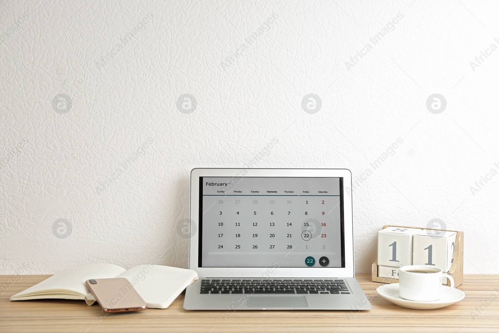 Photo of Modern laptop with calendar app in office