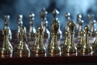 Set of chess pieces on checkerboard before game, selective focus