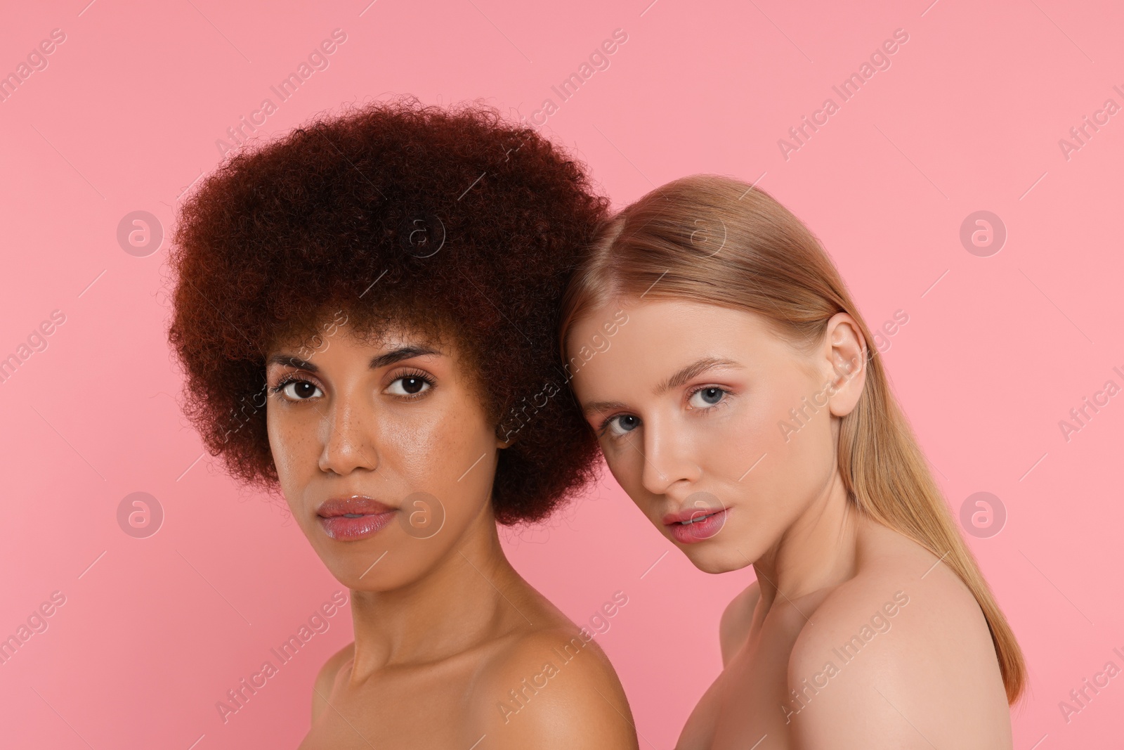 Photo of Portrait of beautiful young women on pink background