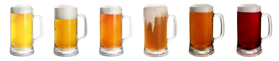 Image of Set with mugs of cold tasty beer on white background. Banner design