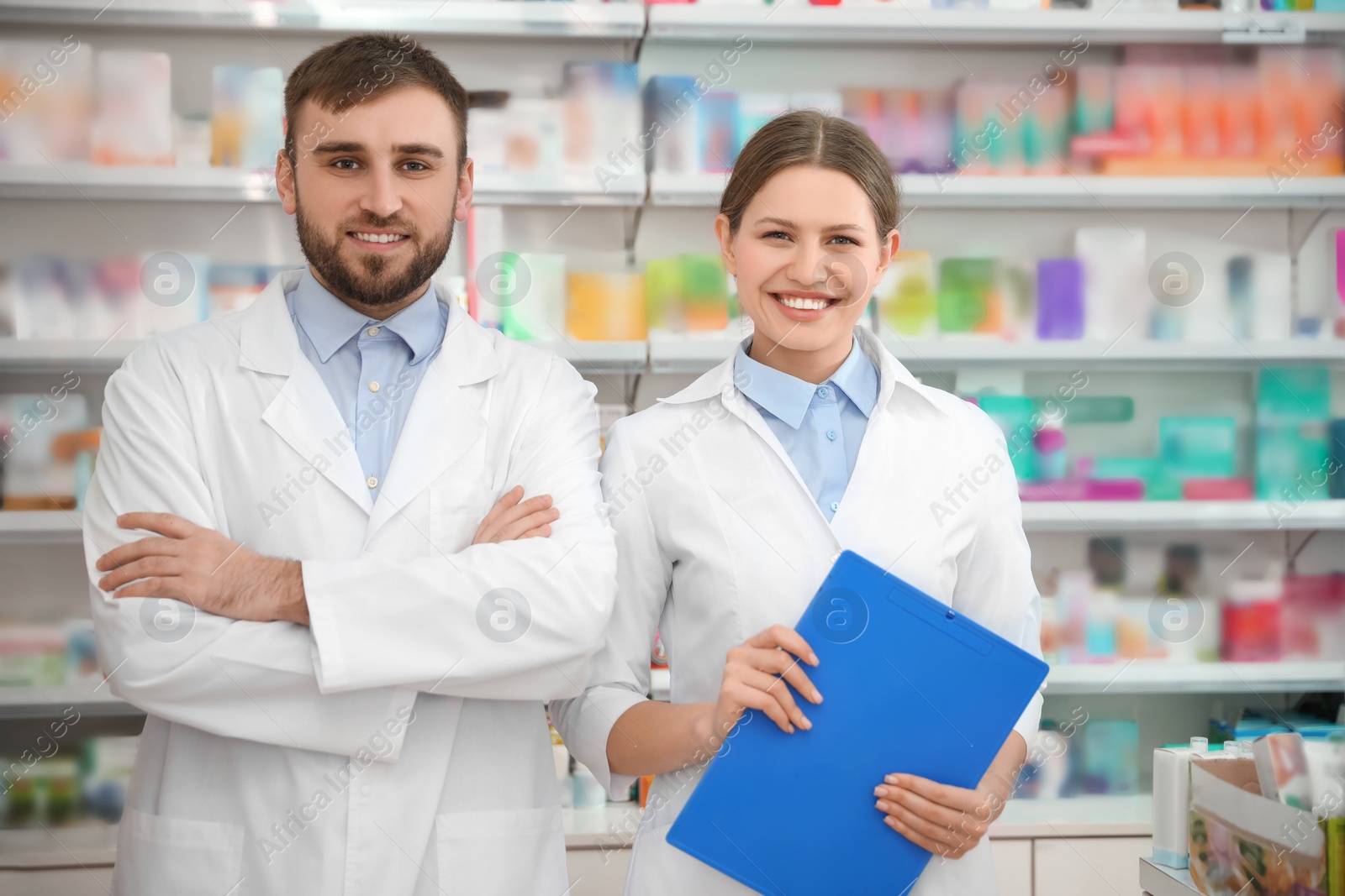 Photo of Portrait of professional pharmacists in modern drugstore