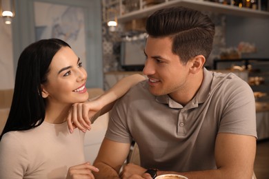 Lovely couple on date at cafe in morning