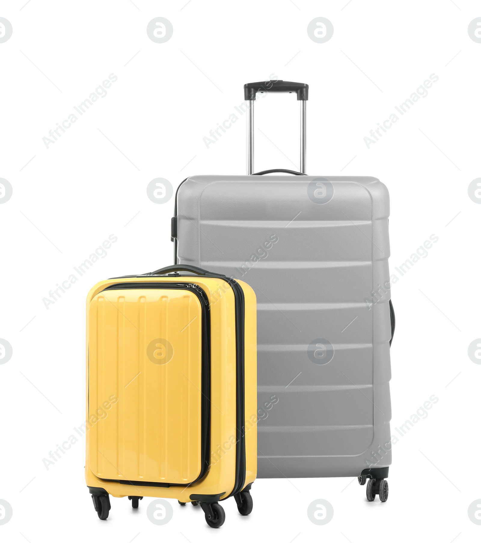 Photo of New suitcases packed for journey on white background