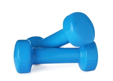 Photo of Color dumbbells on white background. Home fitness