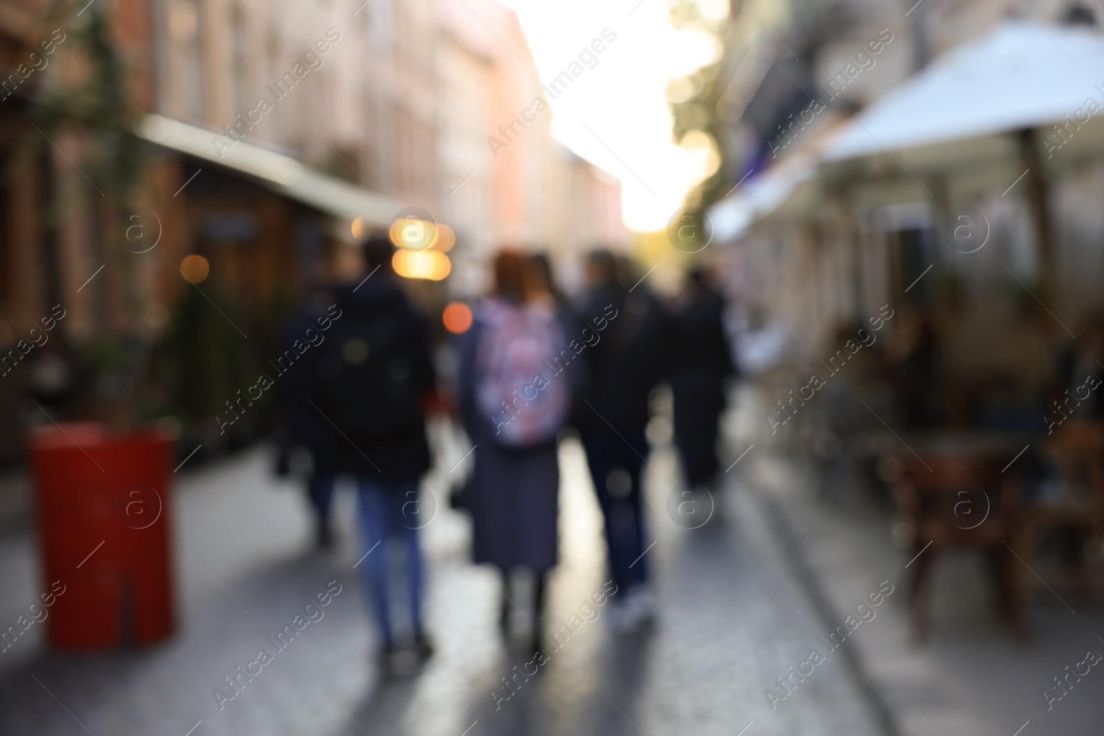 Photo of Blurred view of people walking on city street