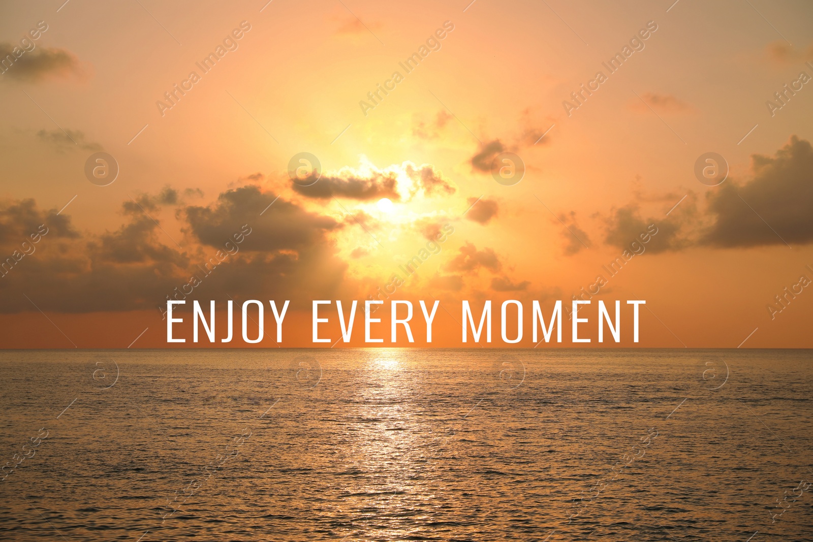 Image of Enjoy every moment, affirmation. Beautiful sky over sea at sunset