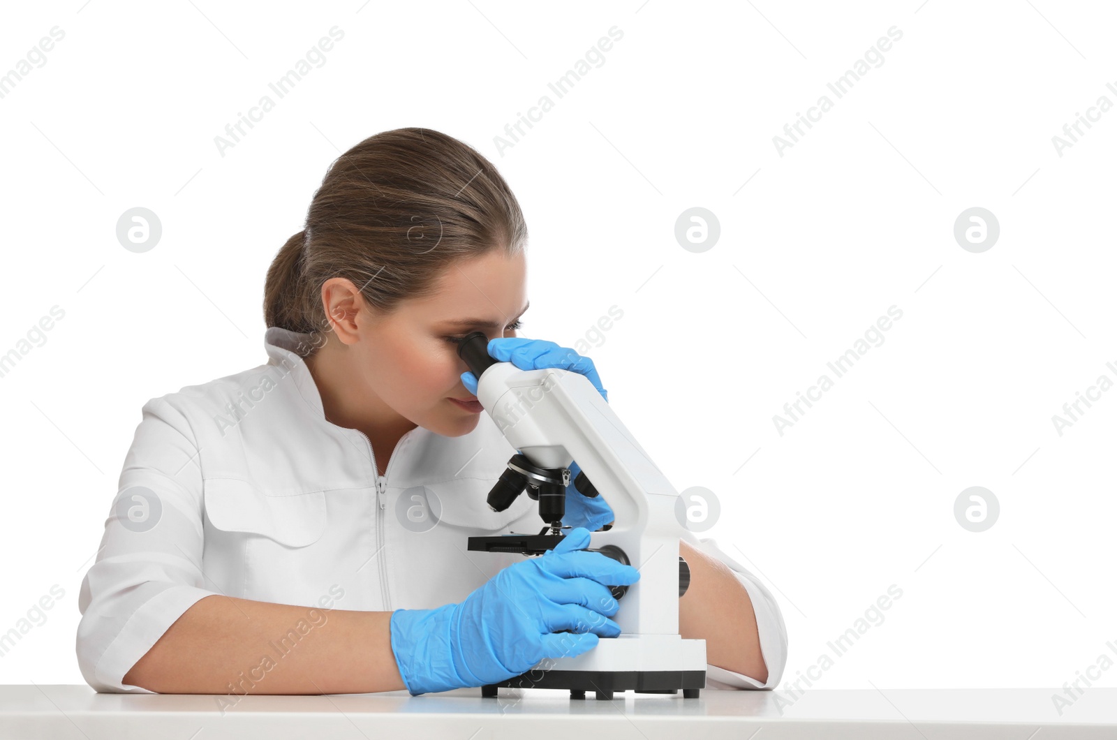 Photo of Scientist using modern microscope at table isolated on white. Medical research