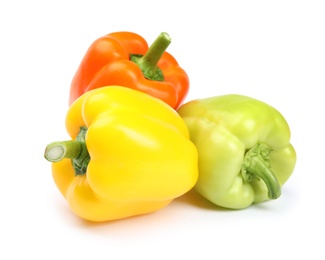 Fresh ripe bell peppers on white background