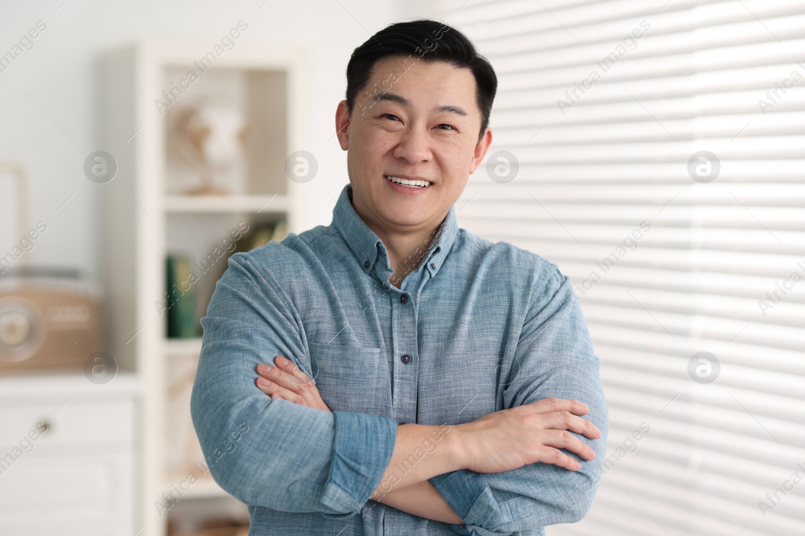 Photo of Portrait of smiling friendly businessman in office