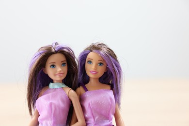 Leiden, Netherlands - September 20, 2023: Beautiful Barbie dolls on light blurred background, space for text