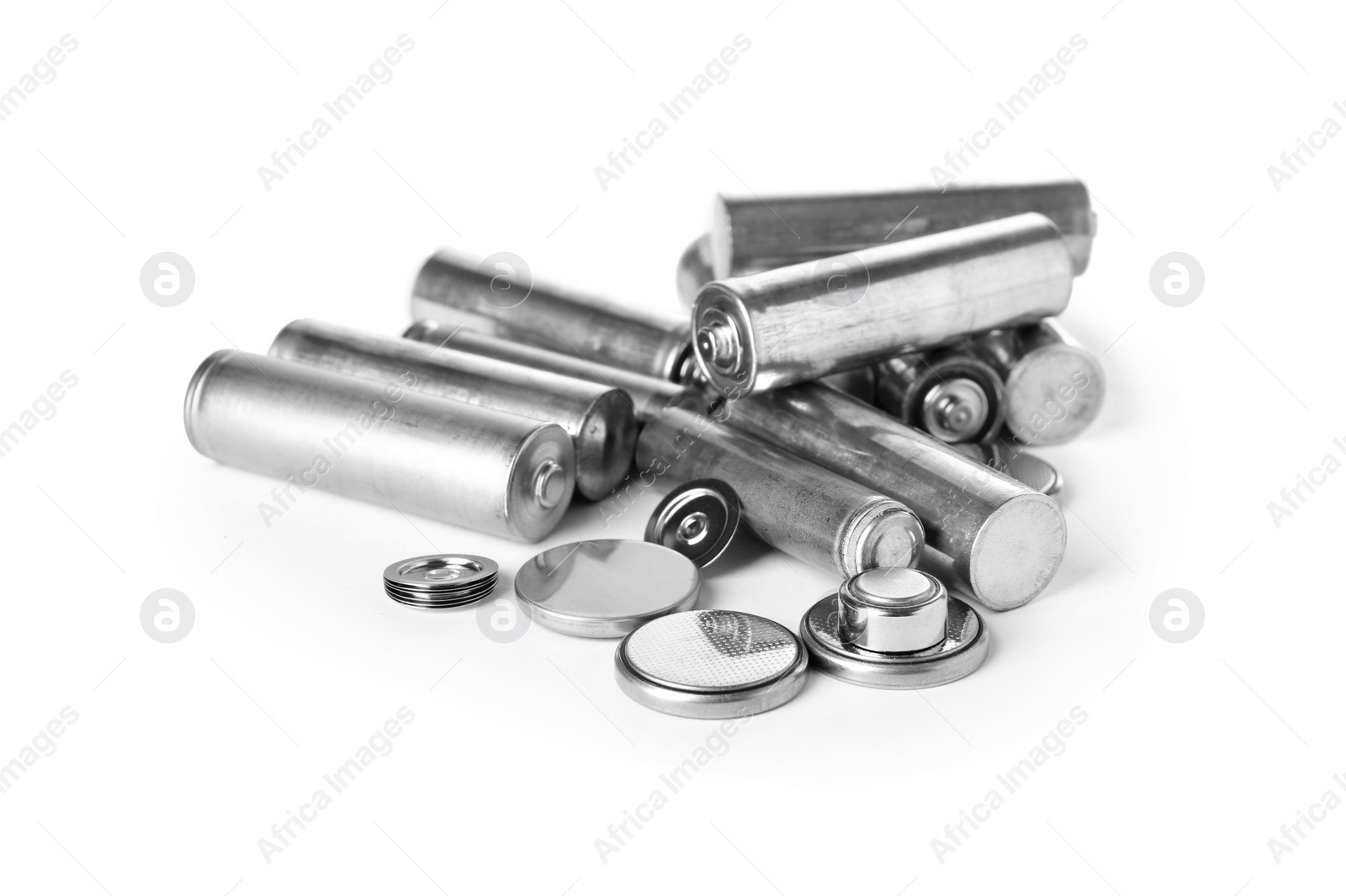 Photo of Used batteries on white background. Recycling problem