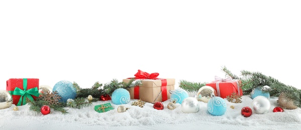 Fir branches, Christmas decoration and snow against white background