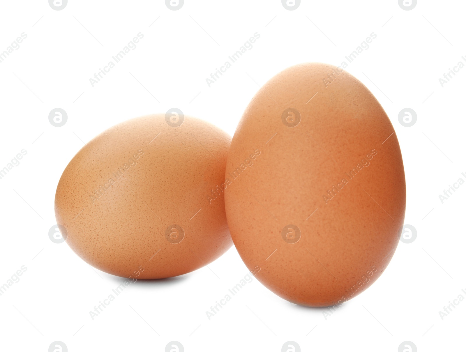 Photo of Raw brown chicken eggs on white background