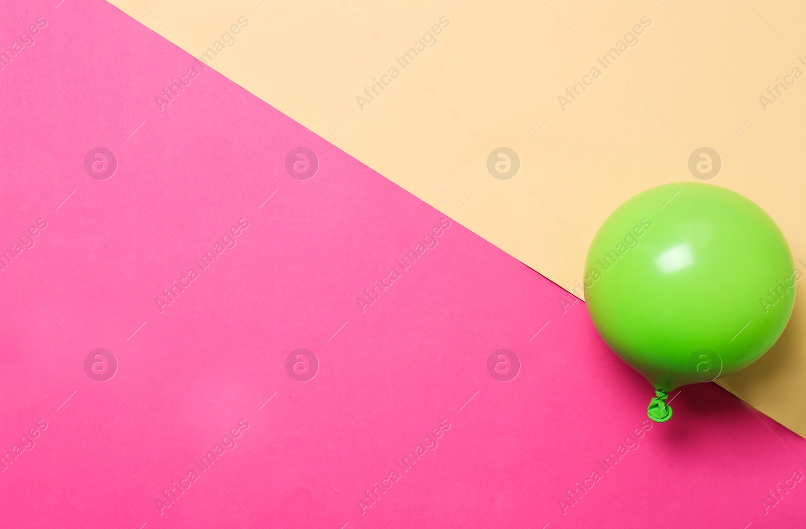 Photo of Bright air balloon on color background. Festive decor