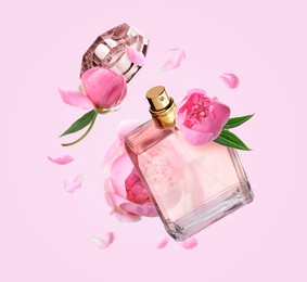 Image of Bottle of perfume and peonies in air on pink background. Flower fragrance