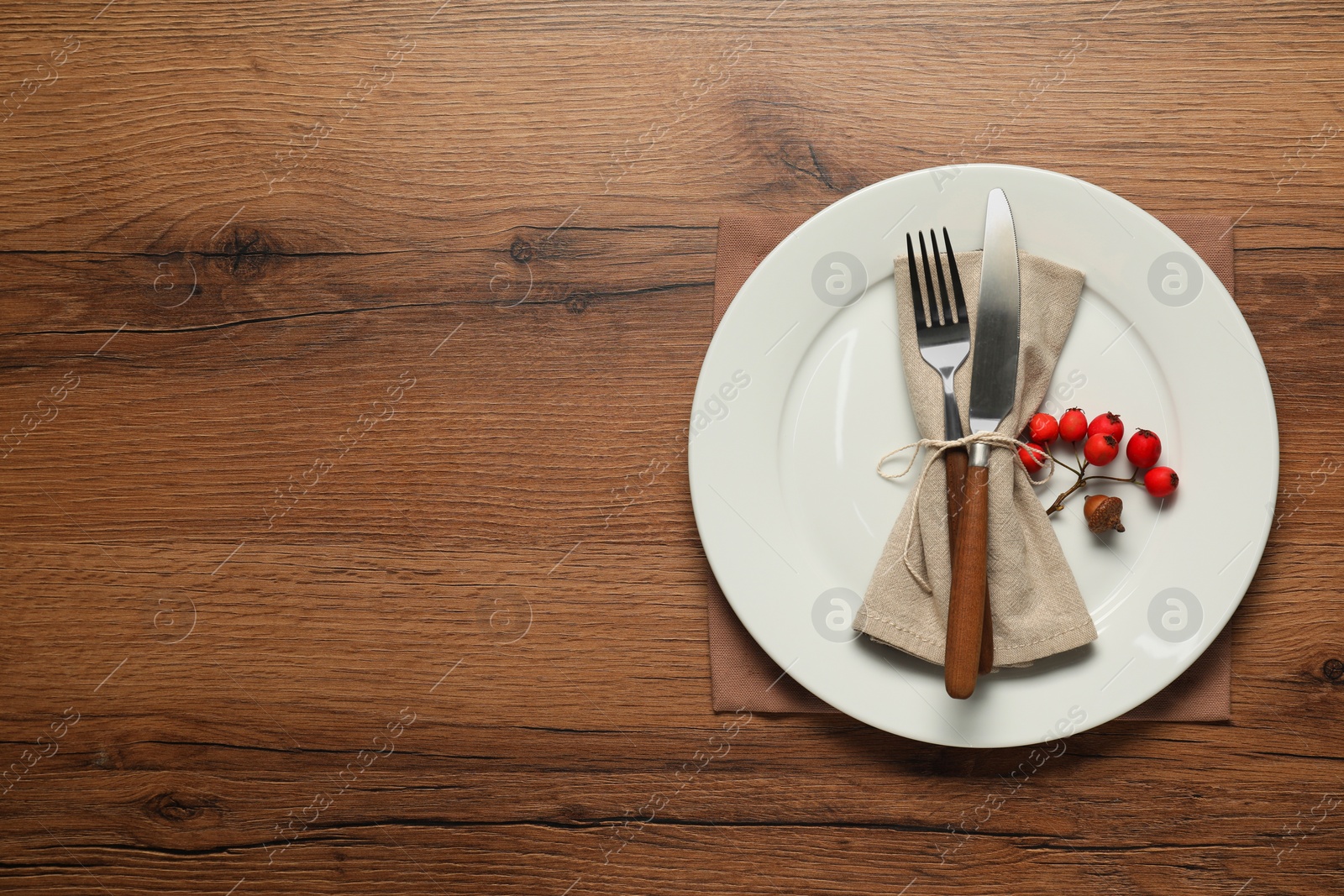 Photo of Stylish autumn table setting on wooden background, flat lay. Space for text