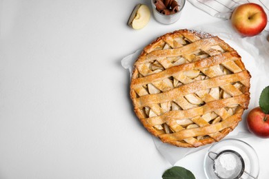 Delicious traditional apple pie on white table, flat lay. Space for text