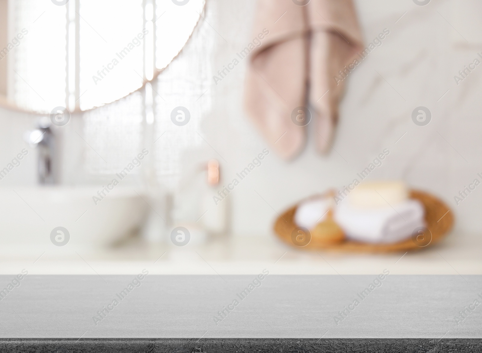 Image of Empty table and blurred view of stylish bathroom interior