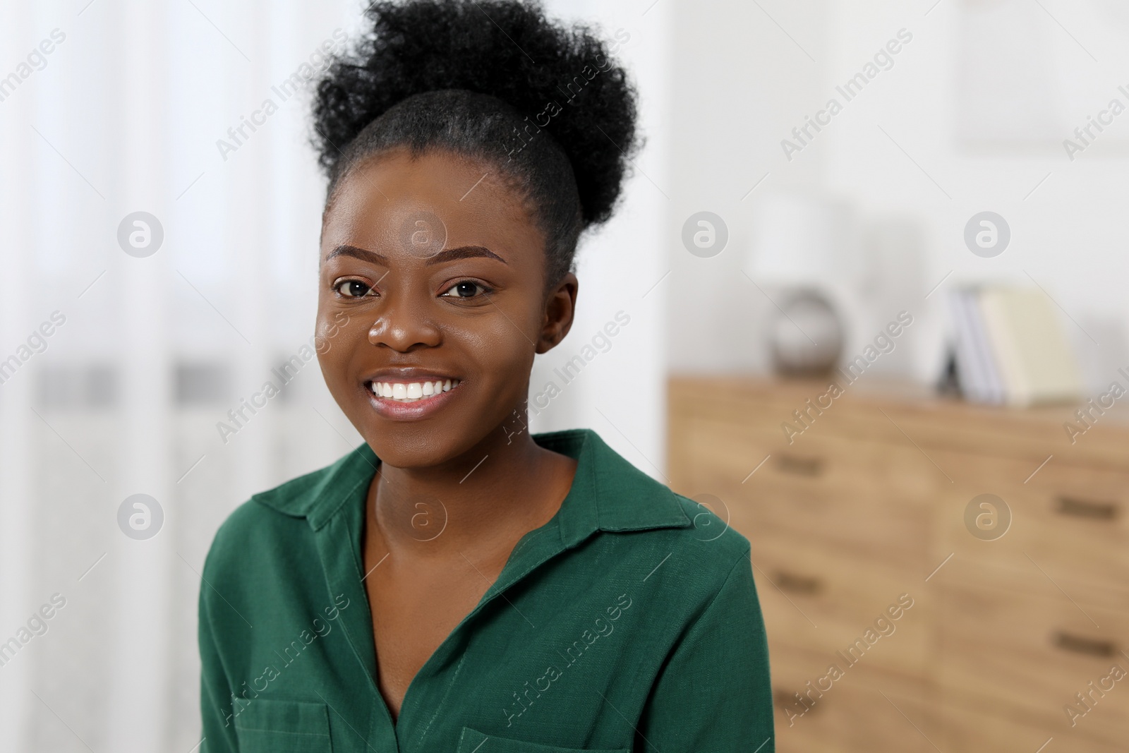 Photo of Portrait of beautiful young woman at home. Space for text